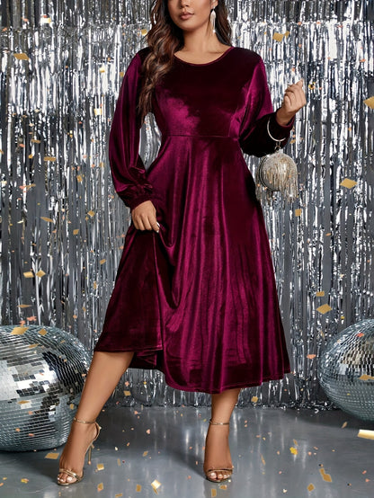 Vestido de veludo  com cintura marcada, manga comprida, gola redonda.